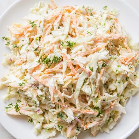Refreshing close-up of Coleslaw with Apple, a vibrant and tangy American side dish.