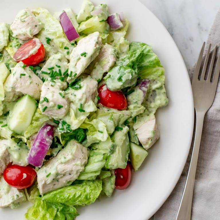 Serving suggestion: a hearty avocado ranch chicken salad with diced cucumbers, cherry tomatoes, and herbs, perfect for lunch or light dinner.